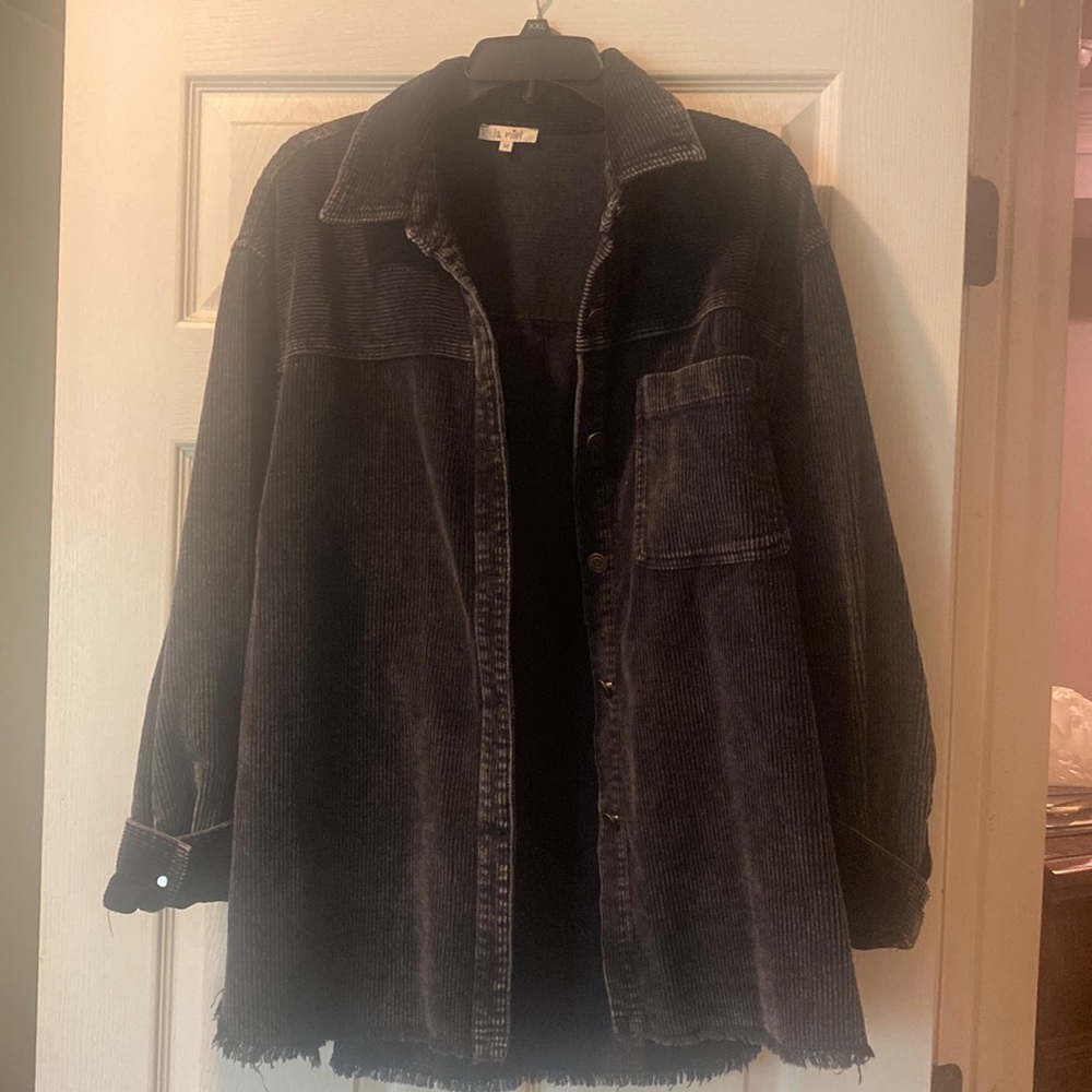 Black oversized corduroy shacket with distressed bottom. Size Medium-oversized.
